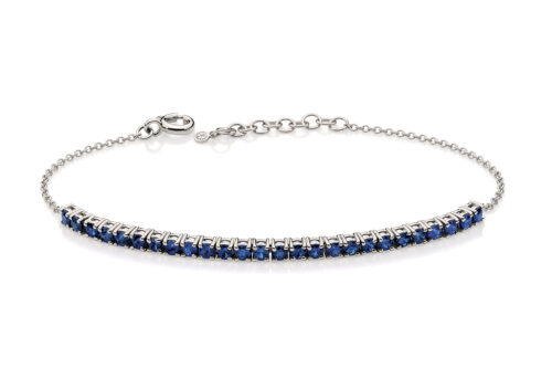 Pulseira meia riviera ouro branco com safiras.