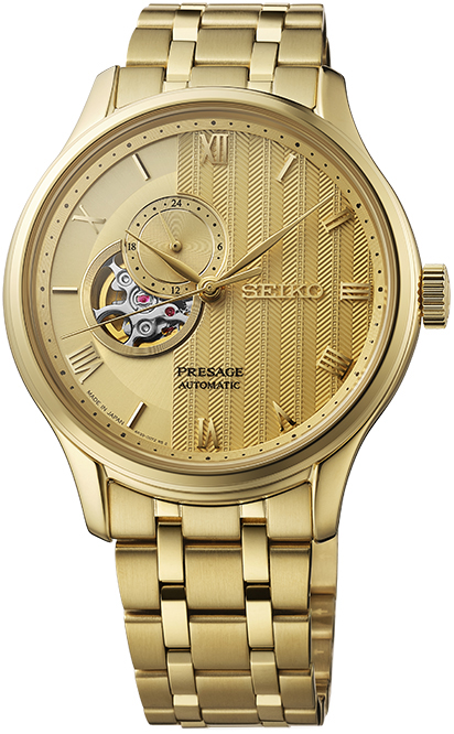 Relógio automático, caixa redonda dourada, mostrador dourado, maquina aparente, romanos, pulseira dourada.